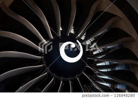 Plane background. Airplane turbine blades close-up. Airplane engine. Turbines blade. Aviation Technologies. Aircraft jet black detail during maintenance. 116848280