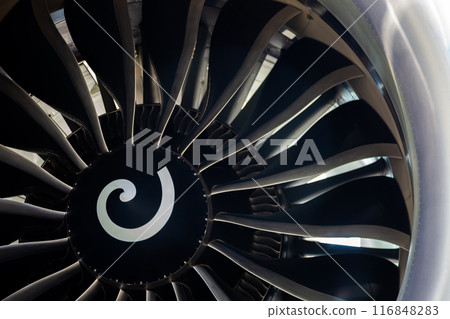Turbine blades of an aircraft jet engine. Close up Turbines Engine. Aviation Technologies. Aircraft jet black detail during maintenance. Background. Macro. Turbine blades of an aircraft jet engine. Close up Turbines Engine. Aviation Technologies. Aircraft jet black detail during maintenance. Background. Macro. 116848283
