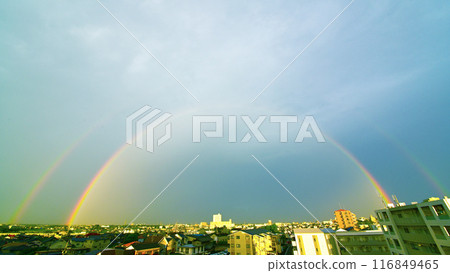A double rainbow appears over the city early in the morning A double rainbow appears over the city early in the morning 116849465