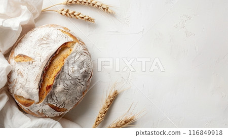 A freshly baked loaf of bread with wheat flour on a white background, with wheat stalks on either side. Generative AI 116849918