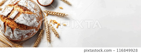 A freshly baked loaf of bread made with wheat flour sits on a white background, surrounded by wheat stalks and wheat sprouts. Generative AI 116849928
