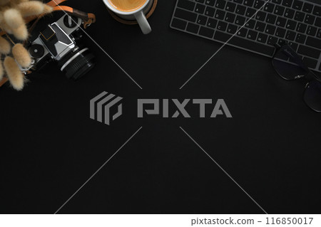 A vintage camera, keyboard and a cup of coffee on black background. Flat lay, Top view with copy space A vintage camera, keyboard and a cup of coffee on black background. Flat lay, Top view with copy space 116850017
