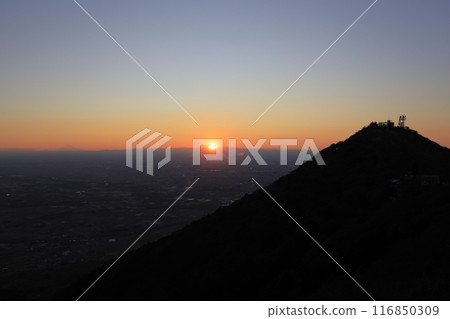 The setting sun and the silhouettes of Mt. Tsukuba, Mt. Nantai and Mt. Fuji in the distance, seen from the Nyotai side of Mt. Tsukuba The setting sun and the silhouettes of Mt. Tsukuba, Mt. Nantai and Mt. Fuji in the distance, seen from the Nyotai side of Mt. Tsukuba 116850309