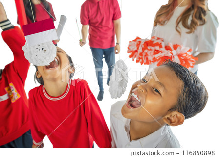 Portrait of Indonesian kids celebrate Indonesia Independence Day with traditional events like an eating crackers contest Portrait of Indonesian kids celebrate Indonesia Independence Day with traditional events like an eating crackers contest 116850898