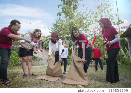 Portrait of Indonesian woman celebrate Indonesia Independence Day with traditional events like a sack race contest 116851399