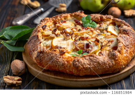 Homemade open pie (galette) with pears, blue cheese and walnuts. Homemade open pie (galette) with pears, blue cheese and walnuts. 116851984