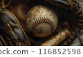 An intricately detailed image of a baseball nestled in a leather glove, with a bat resting on the ground beside it. The baseball's stitches and worn spots are vividly depicted, while the glove's 116852598