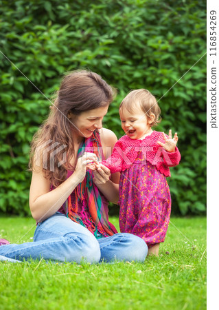 Mother with baby in the park Mother with baby in the park 116854269