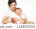 Mother playing with baby on white 116854354