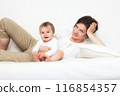 Mother playing with baby on white 116854357