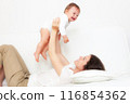 Mother playing with baby on white 116854362