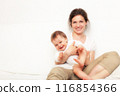 Mother playing with baby on white 116854366