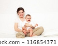 Mother playing with baby on white 116854371