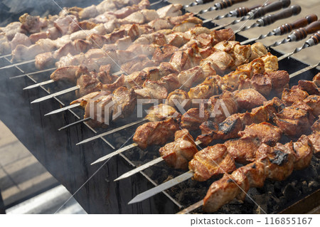 Kebab skewer meat dish. BBQ meat on grill.  116855167