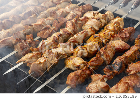 Kebab skewer meat dish. BBQ meat on grill.  116855189