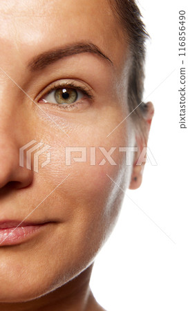 Detailed photo of half of woman's face, preorbital zone with well-kept, smooth and healthy skin. Anti-aging skincare cosmetic products. 116856490