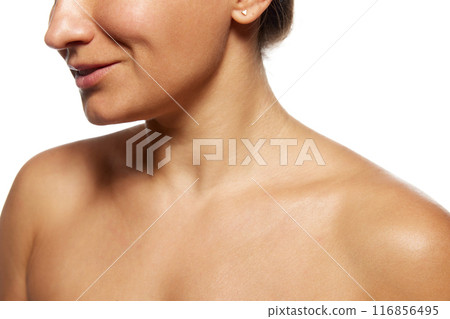 Cropped photo of female neckline with healthy, smooth and soft skin against white studio background. Skin care treatment. Peeling. 116856495