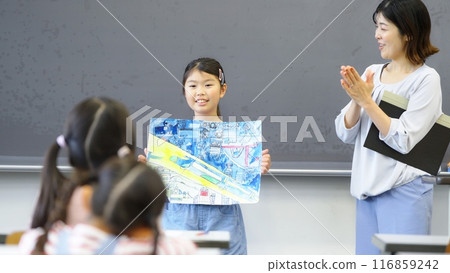 Classmates celebrating their winnings 116859242