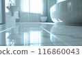 The bathroom floor is sparkling clean, Shiny white bathroom floor. 116860043