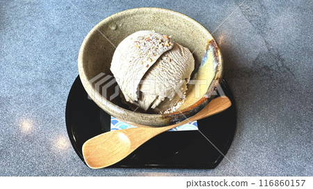 Buckwheat tea flavored ice cream topped with buckwheat seeds Buckwheat tea flavored ice cream topped with buckwheat seeds 116860157