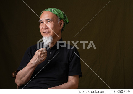 Senior man in his 60s or 70s with a white beard enjoying senior life Senior man in his 60s or 70s with a white beard enjoying senior life 116860709