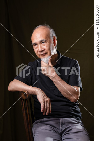 Senior man in his 60s or 70s with a white beard enjoying senior life 116861037