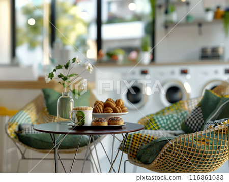 Relaxation Area with Coffee and Pastries in Laundry Room 116861088