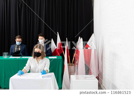 A teenager entitled to vote sits at a polling station and fills out a ballot paper for the President of Poland. A teenager entitled to vote sits at a polling station and fills out a ballot paper for the President of Poland. 116861523