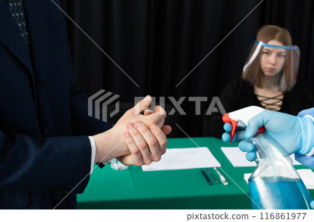 Men's hands thoroughly disinfected before joining the election commission during the presidential election. Men's hands thoroughly disinfected before joining the election commission during the presidential election. 116861977