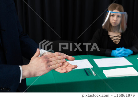 Men's hands thoroughly disinfected before joining the election commission during the presidential election. Men's hands thoroughly disinfected before joining the election commission during the presidential election. 116861979