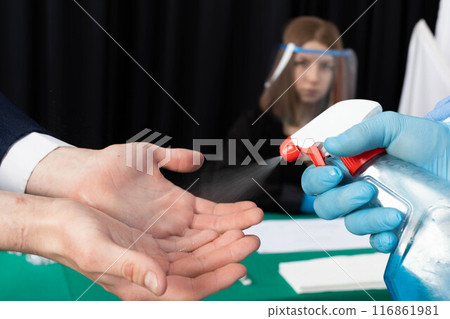 Men's hands thoroughly disinfected before joining the election commission during the presidential election. 116861981