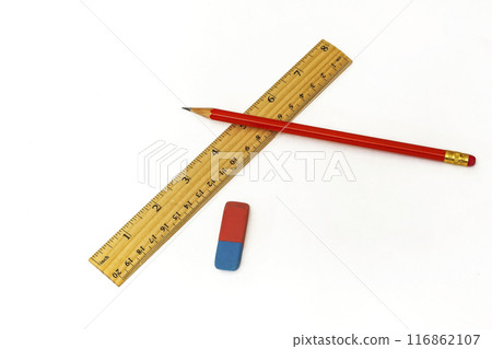 On a white background lie a ruler, an eraser and a simple pencil On a white background lie a ruler, an eraser and a simple pencil 116862107