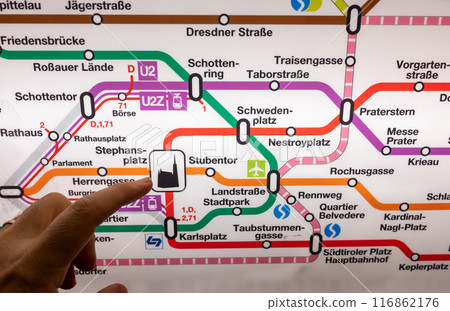 Vienna, Austria, August 21, 2022. Conceptual shot with subway map and finger pointing at cathedral symbol in Stephansplatz. Travel lifestyle. Vienna, Austria, August 21, 2022. Conceptual shot with subway map and finger pointing at cathedral symbol in Stephansplatz. Travel lifestyle. 116862176