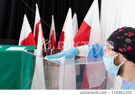 The employee during disinfection tries to thoroughly clean every inch of the ballot box to avoid infection. The employee during disinfection tries to thoroughly clean every inch of the ballot box to avoid infection. 116862205