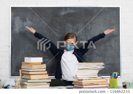 The student is wearing a face and nose mask during a coronavirus pandemic. 116862233