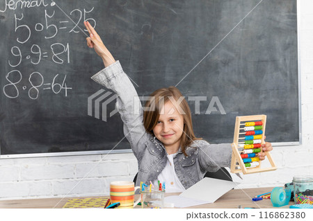 The student reports to answer in class to answer the teacher's question. The student reports to answer in class to answer the teacher's question. 116862380