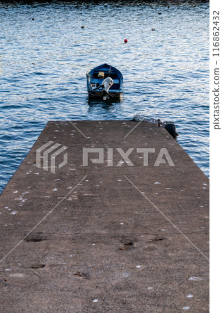 Concrete pier, Atlantic ocean and a boat, Madeira 116862432