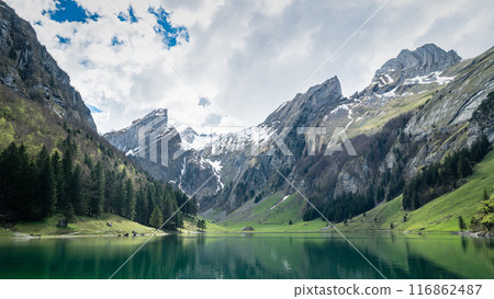 Seealpsee lake with the Swiss Alps in the background, Appenzeller Land, Switzerland Seealpsee lake with the Swiss Alps in the background, Appenzeller Land, Switzerland 116862487