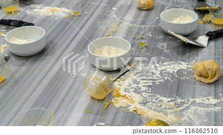 Table full of messy ingredients while baking. Creative mess in the kitchen after cooking, 116862510