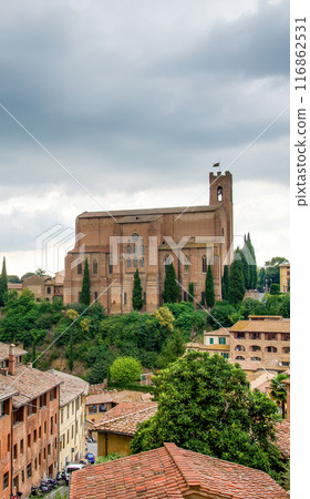 Siena, Toscana, Italy - December 2022: Basilica Cateriniana di San Domenico is a historic Catholic basilica, a major architectural and artistic landmark, known for its beautiful Gothic-style exterior 116862531