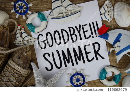 Goodbye Summer text on paper card with marine items decorative top view on wooden background Goodbye Summer text on paper card with marine items decorative top view on wooden background 116862679