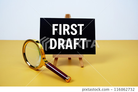 First Draft text on paper card with magnifying glass on yellow background 116862732