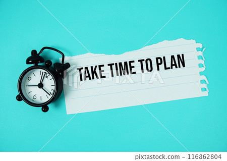 Take Time To Plan text written on paper torn with alarm clock top view on blue background 116862804