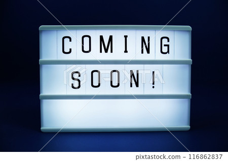 Coming Soon letterboard text on LED Lightbox on blue background 116862837
