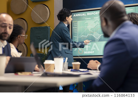 HR specialist evaluating employees performance metrics at the end of the project, looking for new talent within the global business enterprise. Ensuring collaborations under signed contracts. HR specialist evaluating employees performance metrics at the end of the project, looking for new talent within the global business enterprise. Ensuring collaborations under signed contracts. 116864133