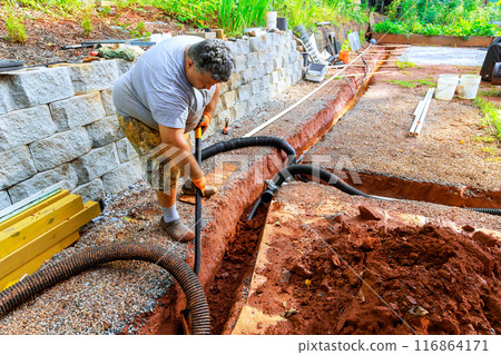 In construction process, drainage pipes are installed underground for outflow of rainwater stormwater 116864171