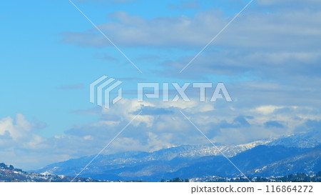 Mountains With Snow-Capped Peaks. Calm Natural Background. Blue Sky Over Hills. Timelapse. Mountains With Snow-Capped Peaks. Calm Natural Background. Blue Sky Over Hills. Timelapse. 116864272
