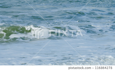 Waves Breaking On The Beach Of Pebbles Surf On The Beach. Waves Washing The Pebble Beach. Still. Waves Breaking On The Beach Of Pebbles Surf On The Beach. Waves Washing The Pebble Beach. Still. 116864278