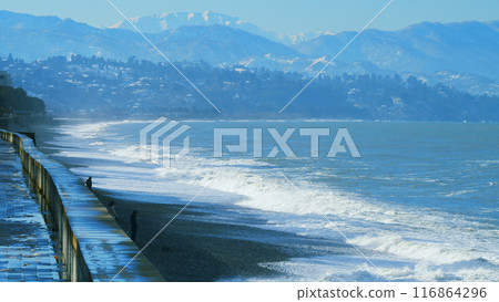 Pebble beach, surf. City embankment illuminated by lanterns. Kobuleti, Adjara, Georgia. 116864296