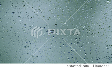 Transparent Raindrops On The Glass. Splashes Of Rain Drops On A Window. Macro shot. 116864358